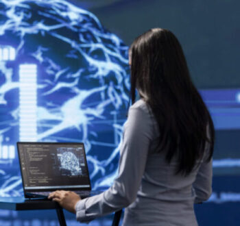 Admin using laptop to maintenance artificial intelligence neural networks made up of interconnected nodes layers. Woman using AI system aiding in processing and transmitting information