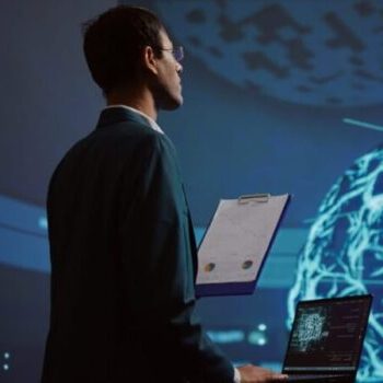 Startup employee looking over business charts, using AI software to take data driven decisions in tech industry. IT expert developing innovative artificial intelligence solutions for company, camera B